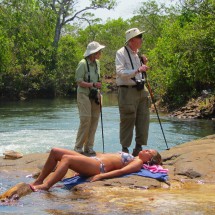 Brazilian beauty with two elderly tourists